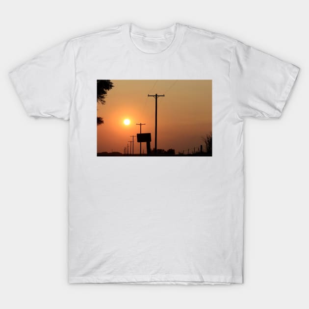 Smokey Kansas Sunset with tree's and power lines. T-Shirt by ROBERTDBROZEK